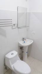 White tile kitchen with refrigerator and stove rental apartment Rincón del Paraíso El Farallón Panama