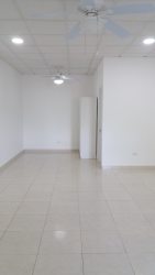 Tropical garden with paved walkways and apartment entrances El Farallón Coclé Panama