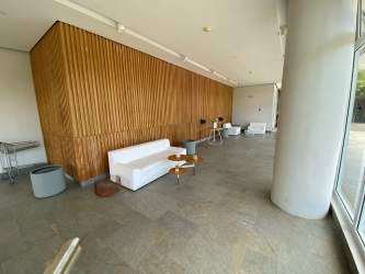 Modern living dining area with panoramic ocean views in PH Solea Punta Barco condo