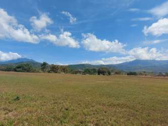 Beautiful landscaped gardens and scenic open fields with mountain views in Boquete Canyon Village Panama