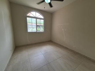 Spacious living room with arched windows, tiled flooring, ceiling fan Santa Clara beach house Panama
