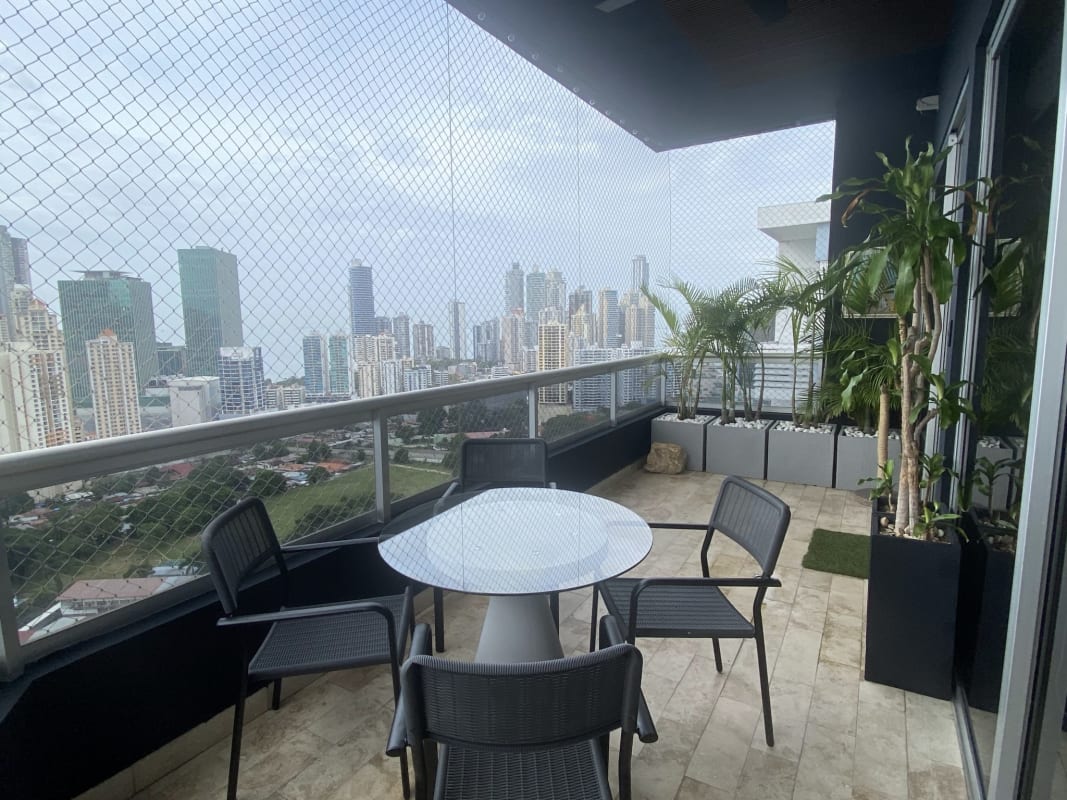 Elegant master bedroom with marble tiles, en-suite bath, balcony and skyline views PH Pacific Coast San Francisco Panama