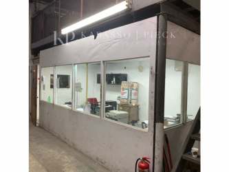 Partitioned office inside warehouse with glass walls and equipment Zona Libre Colon Panama