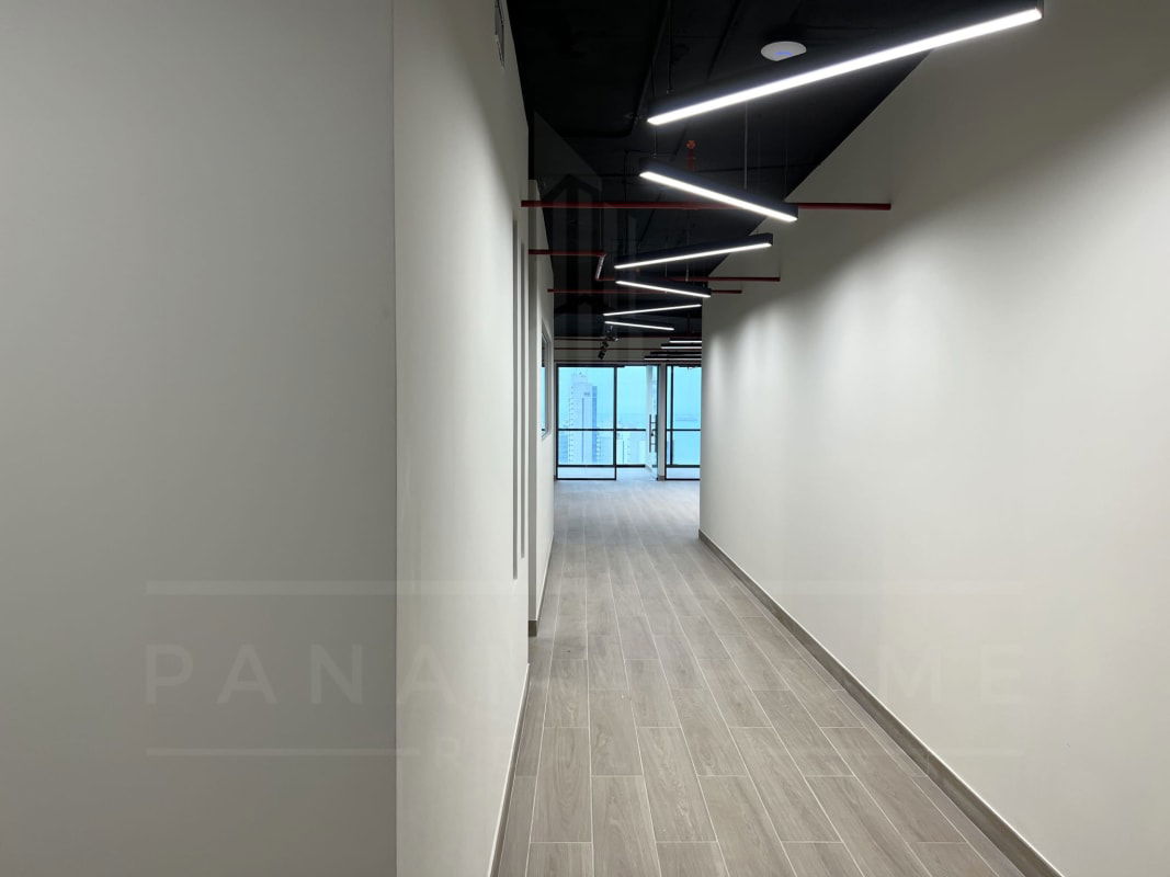 Modern office space with glass enclosures and city views in Tower Bank Financial District Panama