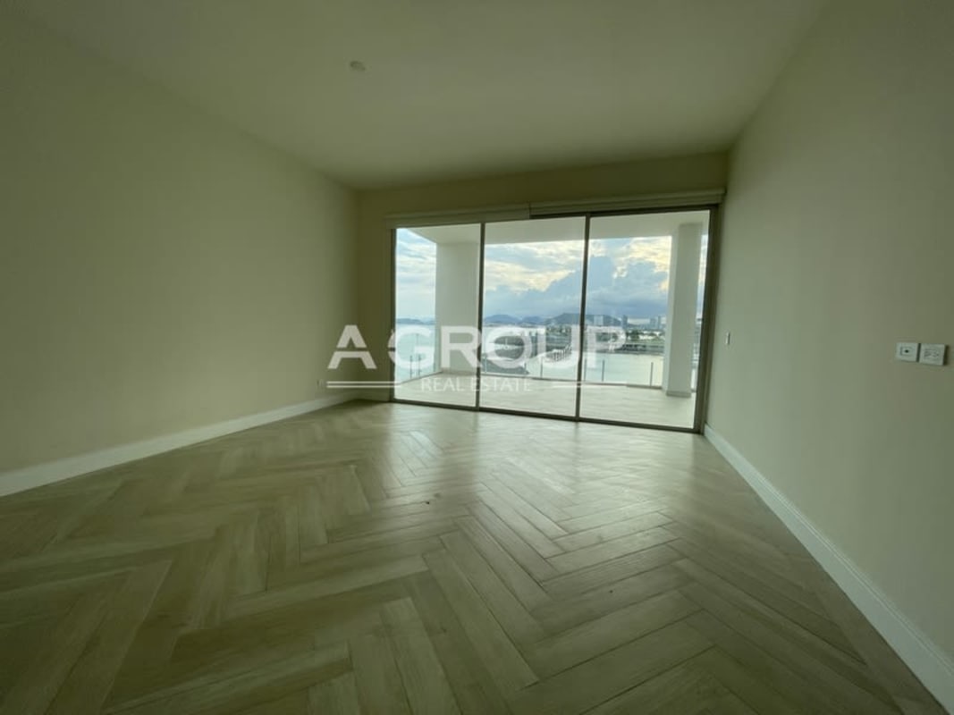 Spacious dining space large windows balcony access luxury condo Ocean Reef Panama