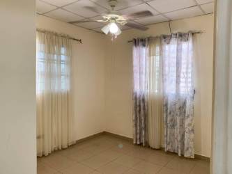 Spacious interior hallway with tiled floors and ceiling fan in affordable house for sale in David Panama