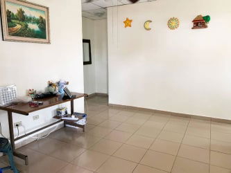 Bedroom with two windows, ceiling fan, tile floor in affordable David Chiriquí house for sale