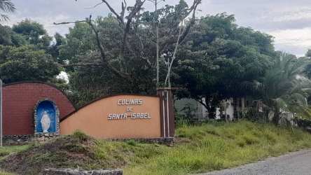 Residential entrance with sign and landscaping at Colinas de Santa Isabel community in David Chiriquí Panama