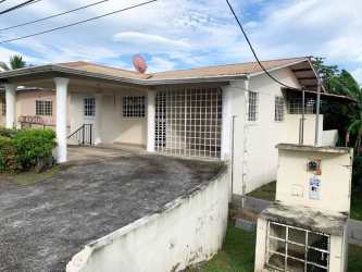 Living room with tile flooring, window, neutral tones in affordable house David Chiriquí Panama