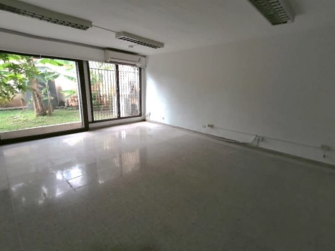 Spacious living room with porcelain tile floors and large windows in La Alameda Betania Panama City