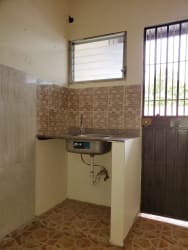 Small kitchenette with window and bars in Aguadulce property investment sale Panama