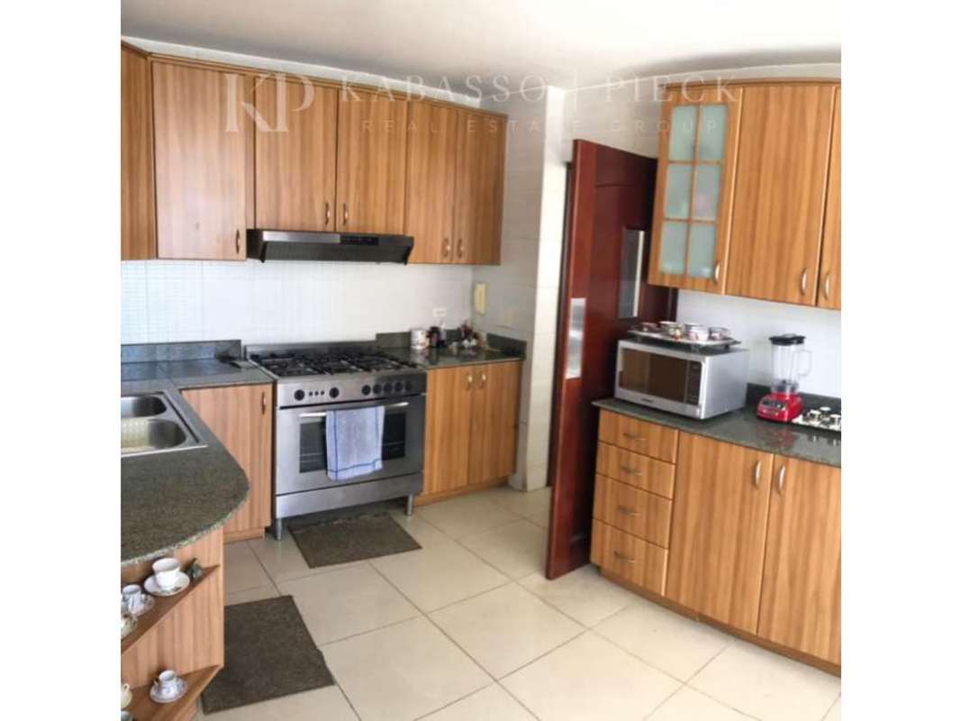Kitchen with granite countertops wood cabinetry stainless appliances Vista del Sol