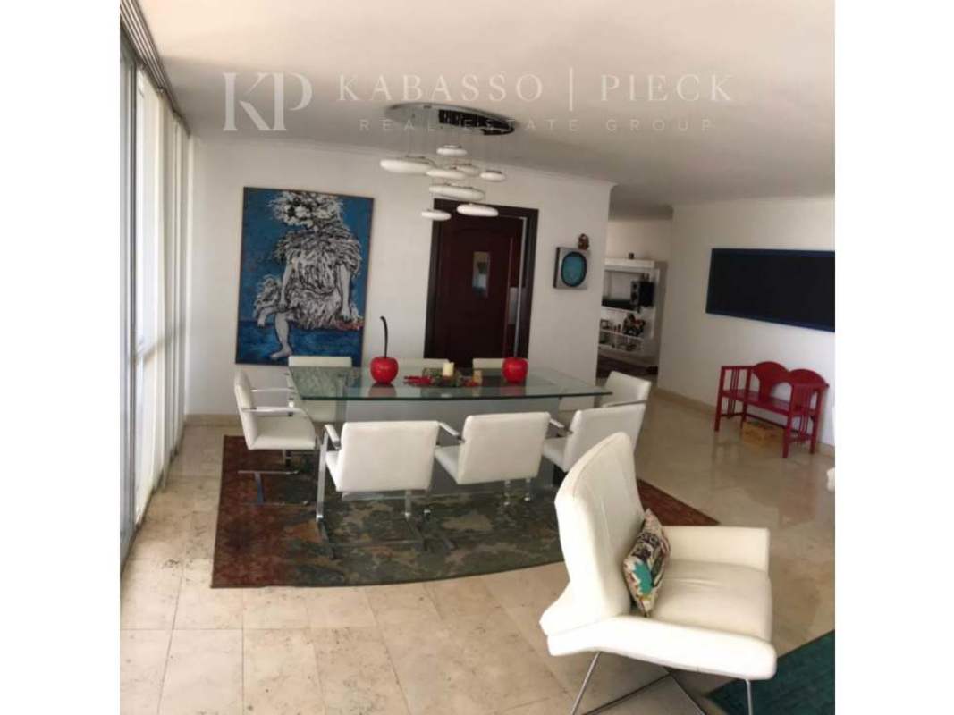 Dining room glass table white chairs large windows modern art Vista del Sol