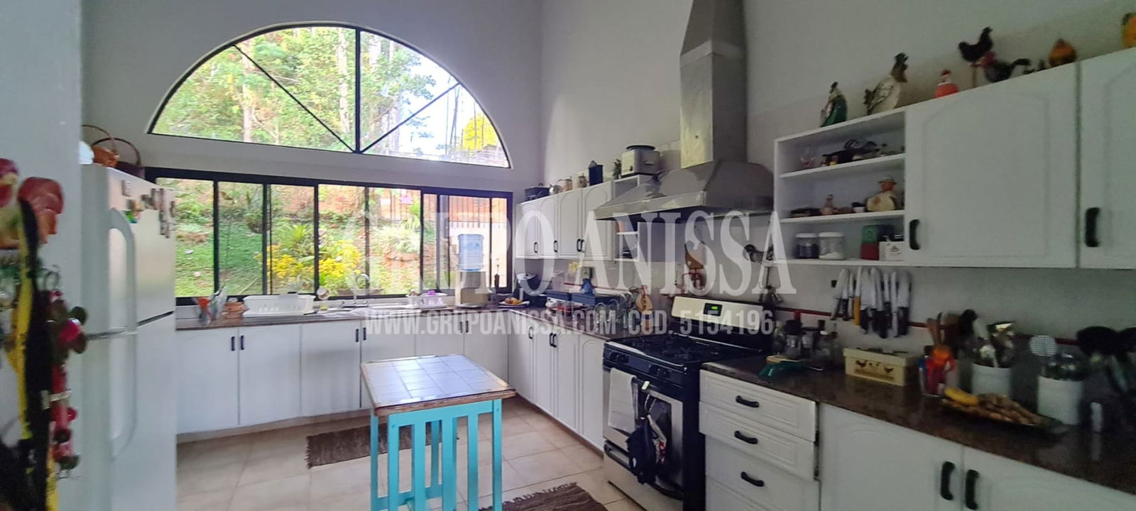 Rustic style mountain villa exterior with stone details, lush gardens Los Altos de Cerro Azul Panama