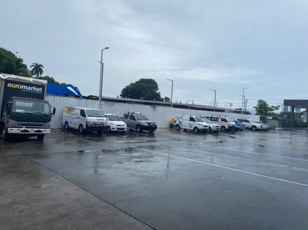 Parking lot full of commercial vehicles outside warehouse in Juan Díaz industrial park Panama City