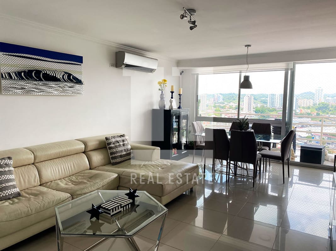 Modern living dining room with large windows and panoramic city views in PH Sky Level Hato Pintado Panama