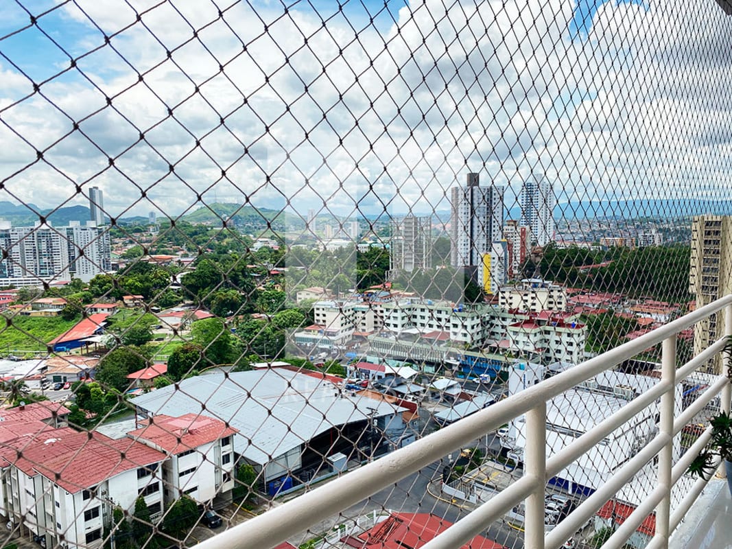 Balcony with safety mesh overlooking Panama City skyline in PH Sky Level tower