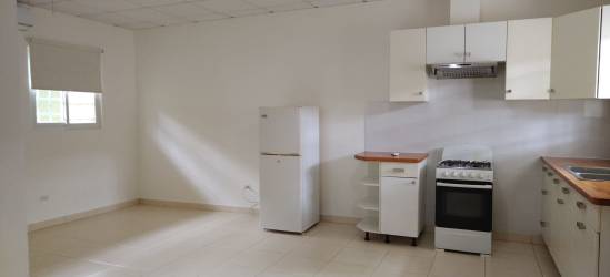 Covered parking spots with paved walkways in Rincon del Paraiso Anton Panama