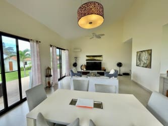 Bright open living and dining area with garden and ocean views in Pedasi beach villa