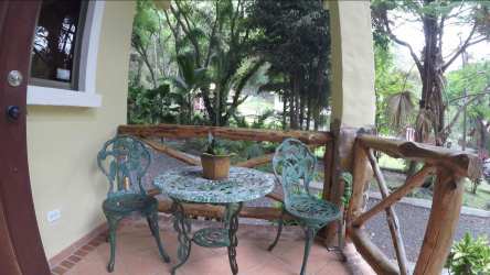 Covered terrace framed by lush greenery in Altos del María Panama