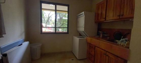 Spacious kitchen granite countertops wooden cabinetry in mountain home Panama