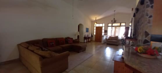 Cozy living space with vaulted ceilings, natural light in mountain villa Panama