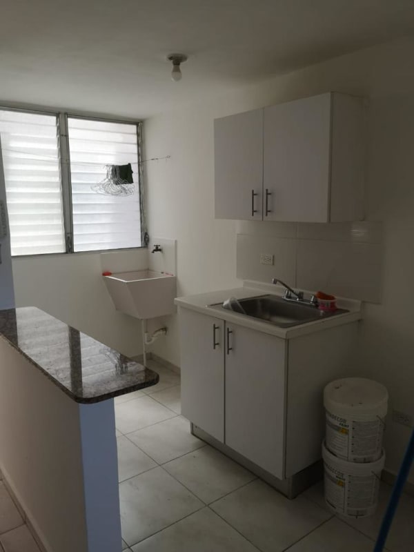 Compact laundry space with utility sink inside apartment PH Residencial Llano Bonito Panama