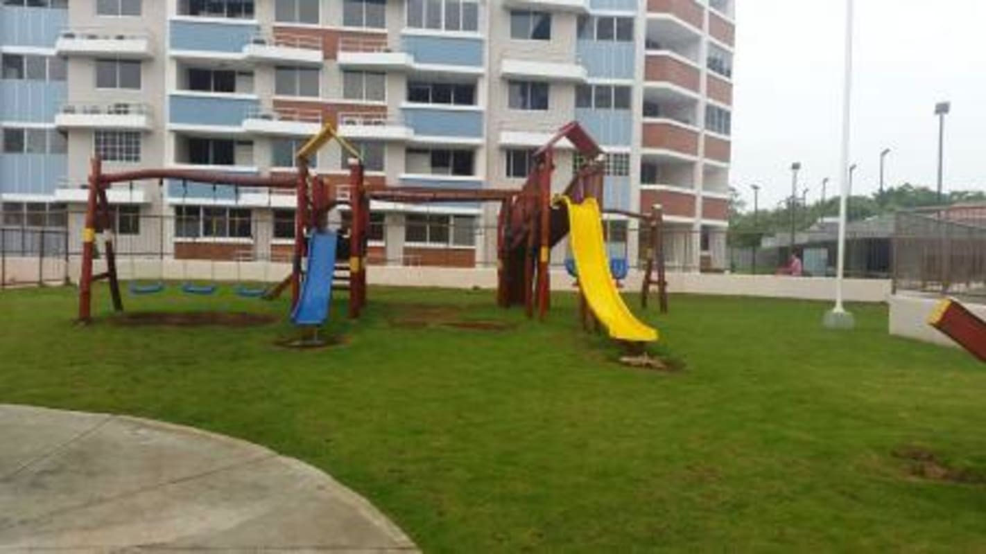 Children playground area with swings and lawns PH Residencial Llano Bonito Panama