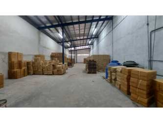 Small office area with window inside a commercial warehouse in Zona Libre de Colon