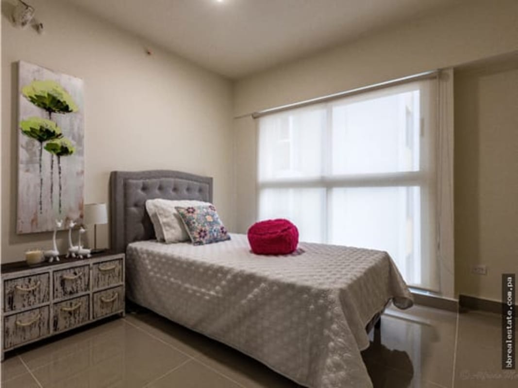 Cozy bedroom with large window natural lighting in PH Residencias del Sol Panama City