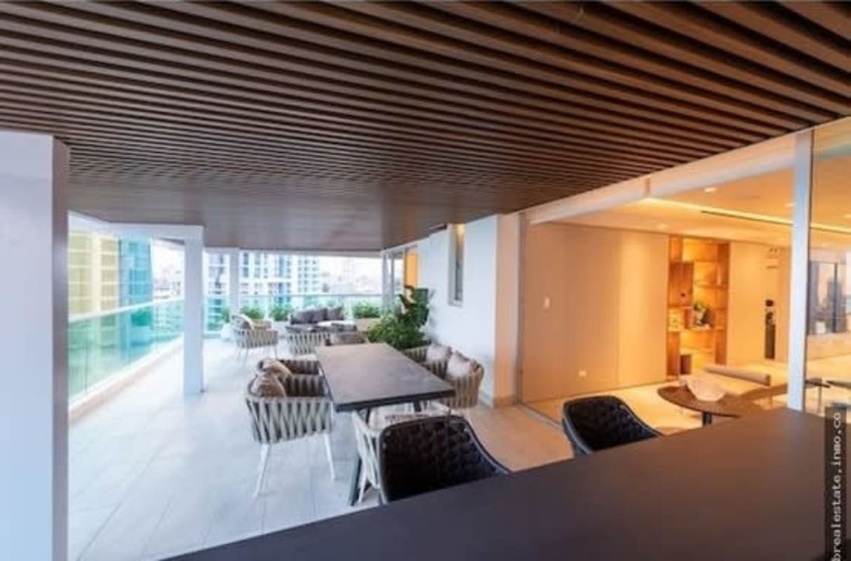 Spacious balcony terrace with glass railings and stunning ocean city views at PH Costanera Panama