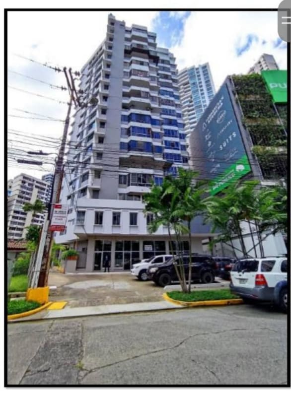 Modern commercial building exterior large windows and parking Marbella Panama