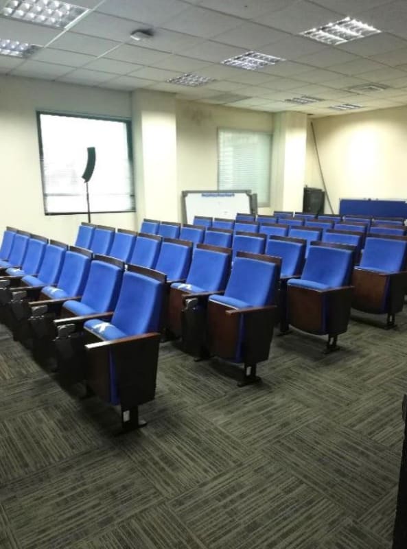 Auditorium space for meetings or seminars with blue seating PH BICSA Building Panama