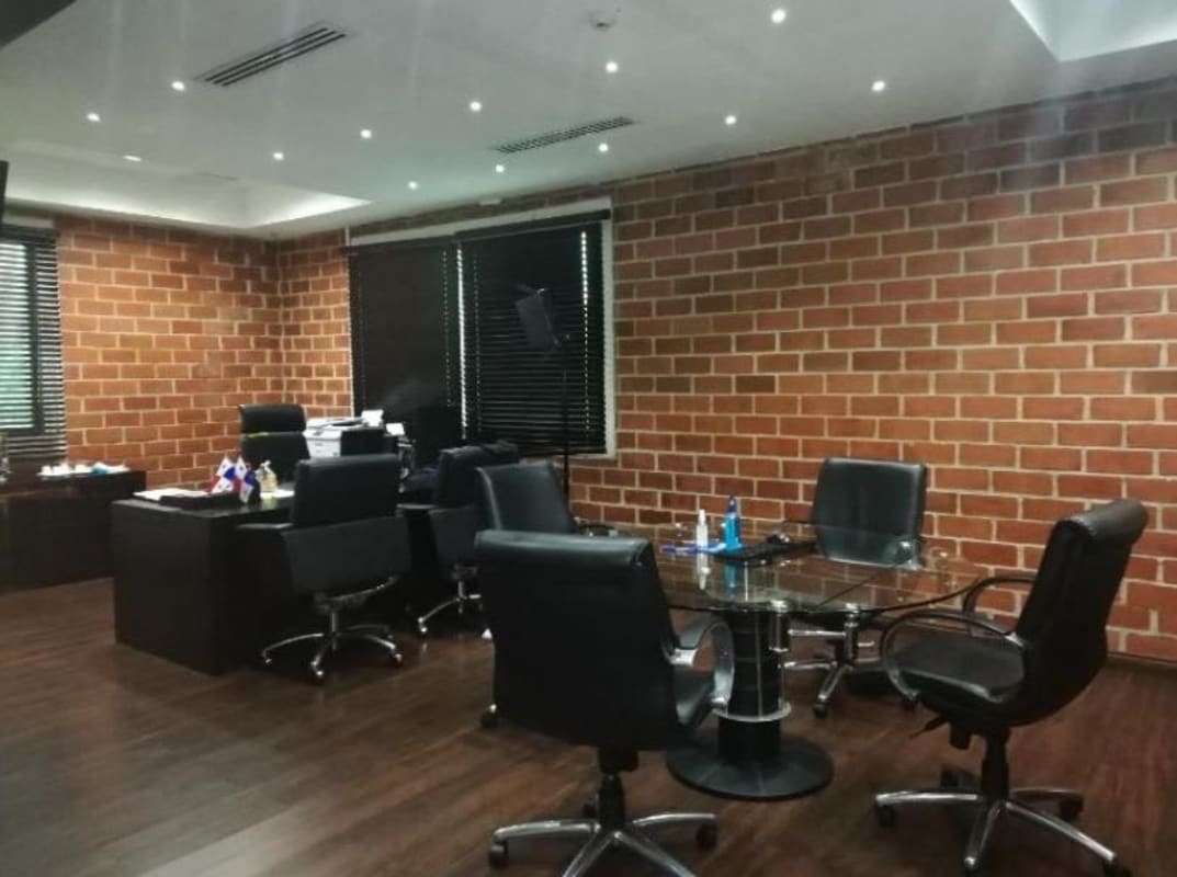 Executive office area with exposed brick wall modern design in PH BICSA Tower Obarrio