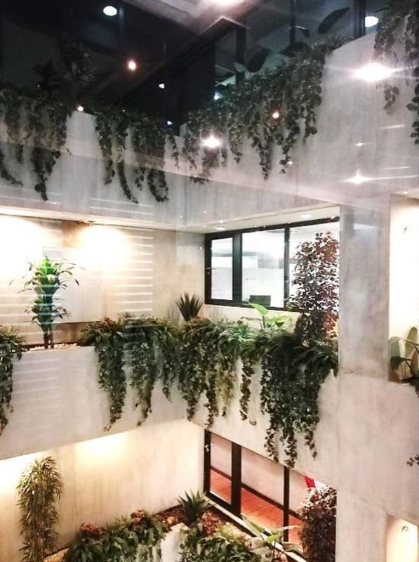 Internal atrium with multiple floors and greenery PH BICSA Financial Center Obarrio Panama