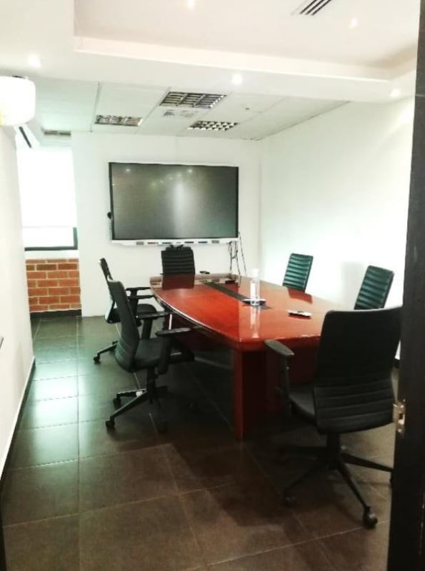 Corporate office workspace with glass walls and cubicles PH BICSA Financial Center Panama City