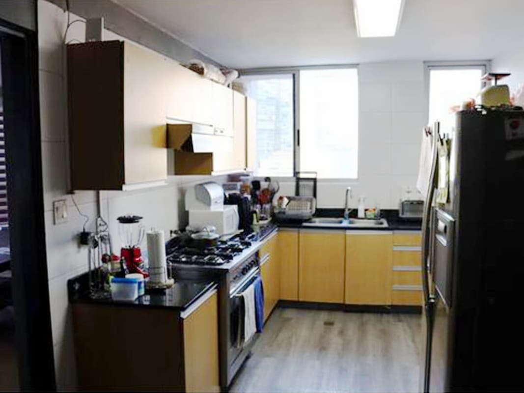 Kitchen with cabinets, appliances, lots of light PH Pacific Coast Panama San Francisco