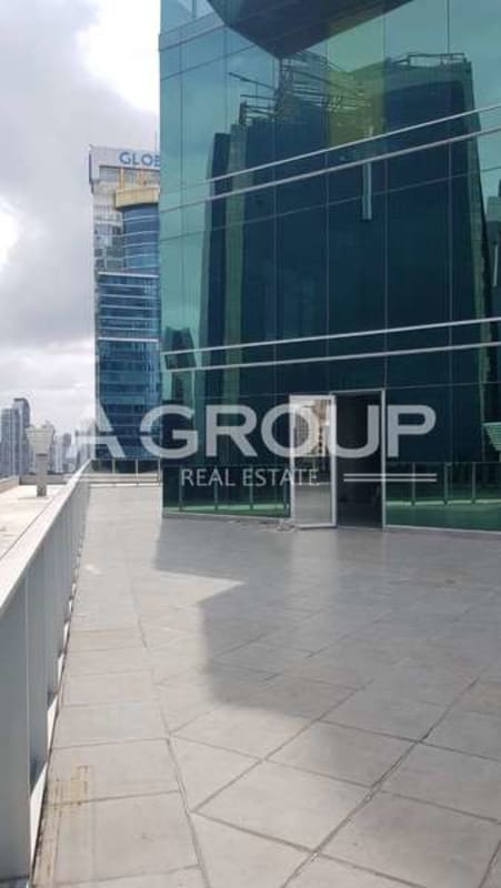 Iconic twisting skyscraper Revolution Tower with glass facade and mountainous backdrop in Panama City