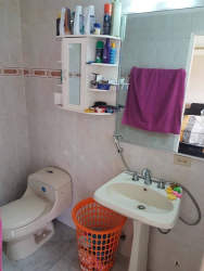 Bathroom with cabinet, mirror and laundry basket in Espinar area Panama