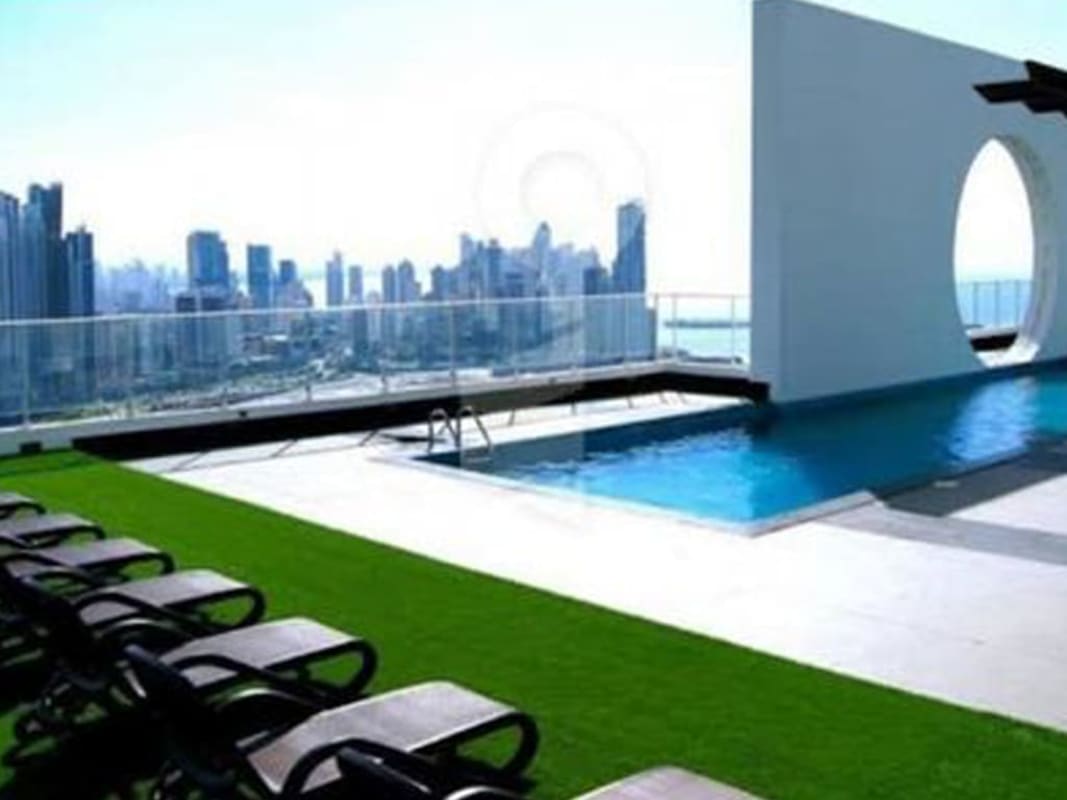 Modern bedroom with ocean view and balcony access at PH Destiny Tower Avenida Balboa Panama