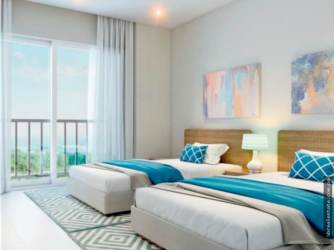 Bedroom with sliding glass doors to terrace and ocean views in Bijao Beach Resort Panama