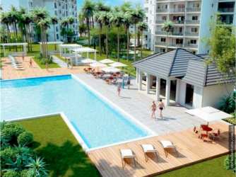 Aerial photo of Bijao golf resort, beachfront, pools, towers, and lush gardens in Panama