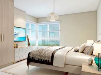 Beachfront resort pool with palm trees and cabanas at Bijao Beach Club & Residences Panama