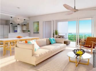 Spacious dining and living zone overlooking pools and beach at Bijao Beach Club Panama