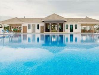 Spacious covered terrace with seating overlooking gardens at Bijao Beach Club Panama