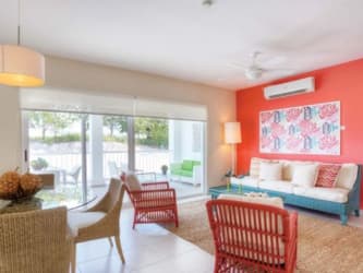 Spacious bedroom with large windows and colorful decor in Bijao Beach Club Rio Hato Panama