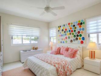 Bright bedroom with sliding doors to terrace at Bijao Beach Residences Panama