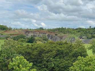 Open pasture grazing land under blue sky rural El Moro Herrera Panama