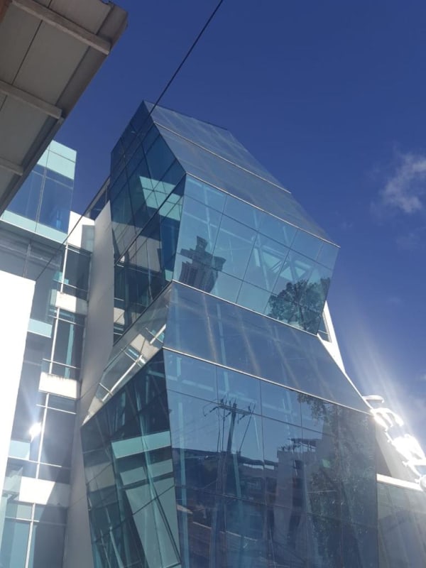 Asymmetrical glass front commercial office PH LeBlue with parking on Vía Brasil Panama City