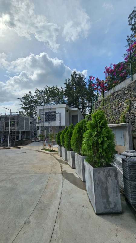 Boutique residential development under construction surrounded by greenery in Clayton Panama City
